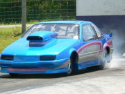 Bright Blue Beretta Drag Car Doing Burnout